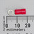 Molex 19070-0007 red ring tongue terminal shown against a millimeter scale.