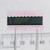 Top view of Maxim MAX186CEPP integrated circuit on foam next to a ruler.