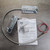 Overview of GE Security Sentrol 2204A-L overhead door contact switch, magnet, hardware, and instructions.
