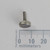 PartsMine 4-40 x 3/8 x 3/8 thumb screw standing vertically on its knurled head above a millimeter ruler.