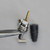Gold-plated center pin and threaded insulator assembly for Amphenol 31-356 held in tweezers.