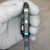 Front face of Keyence FS-T2P with protective cover open showing control switches.