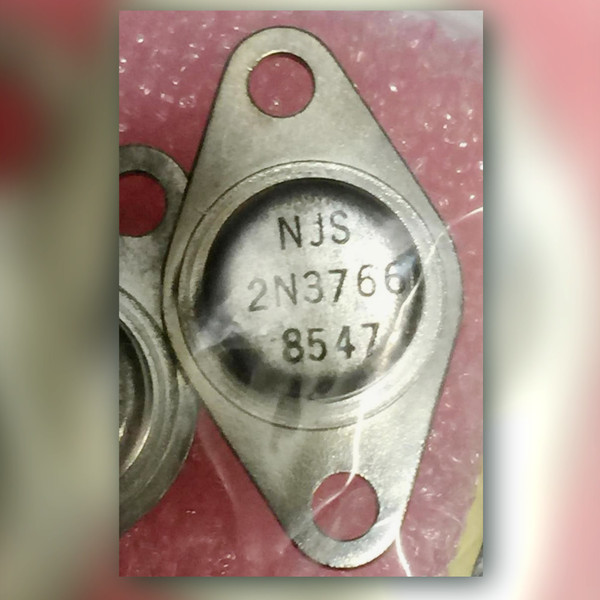 NJS 2N3766 NPN power transistor in a TO-66 diamond-flange metal can, second can below