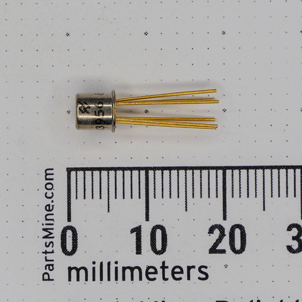 National Semiconductor 2N3956 Dual N-Channel JFET in a TO-71 metal can package with six gold leads, measured against a millimeter ruler.