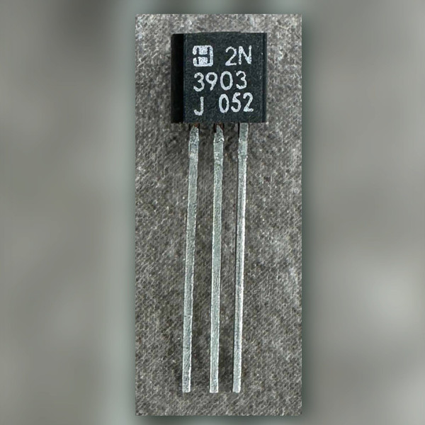 Harris 2N3903 TO-92 transistor face-on, square H logo, 2N 3903 J 052 marking, three leads