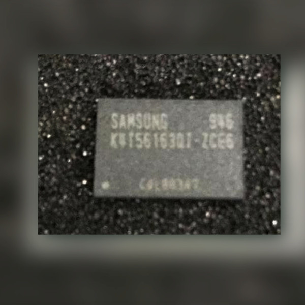 Samsung K4T56163QI-ZCE6 DDR2 SDRAM chip with gray marked top on a dark speckled surface