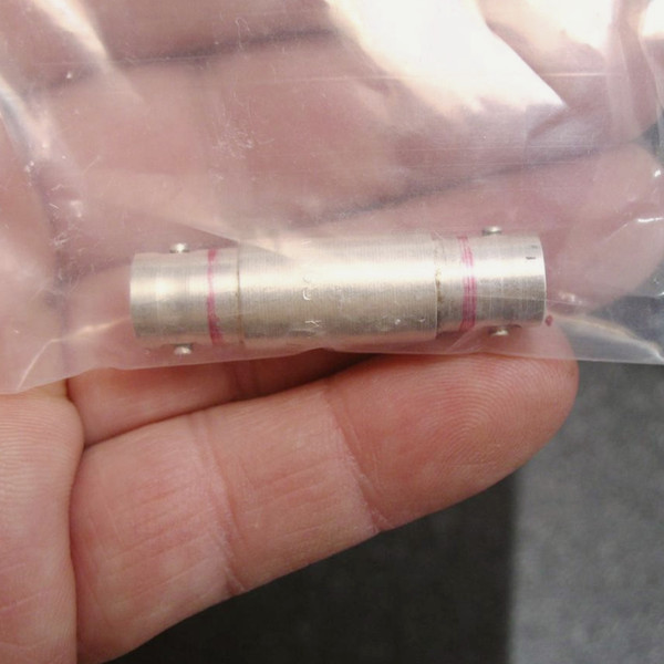 Brushed silver-plated brass barrel body with two pink circumferential band markings and small set screws visible on each end flange.