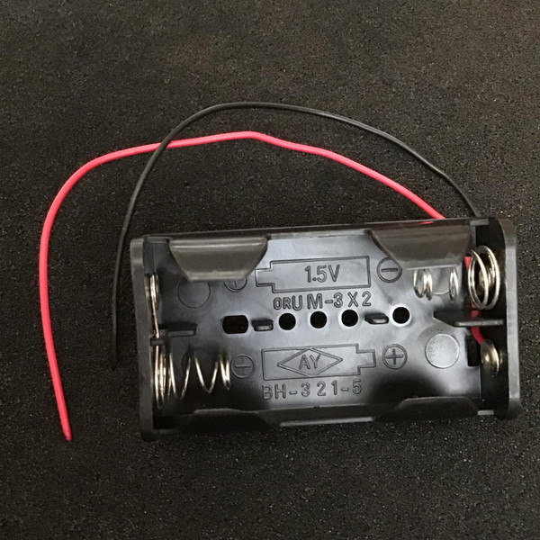 BH-321-5 two-cell AA battery holder, empty, molded 1.5V UM-3 X2 marks, red black leads