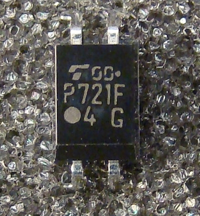 Markings read "P721F" and "4 G" with Toshiba logo; all six SMD leads appear straight and unsoldered, body clean.