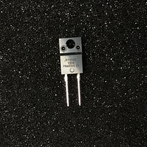 Two-lead full-pack diode with mounting hole, marked BY459X and 1500, on dark speckled surface