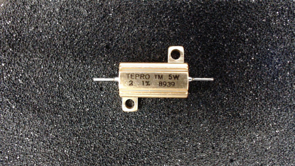 Aluminum chassis-mount power resistor (TEPRO TM) featuring a gold-colored rectangular housing, mounting flanges with screw holes, and axial wire leads. The housing is clearly marked with "TEPRO TM 5W" and "2 Ω 1% 8939".