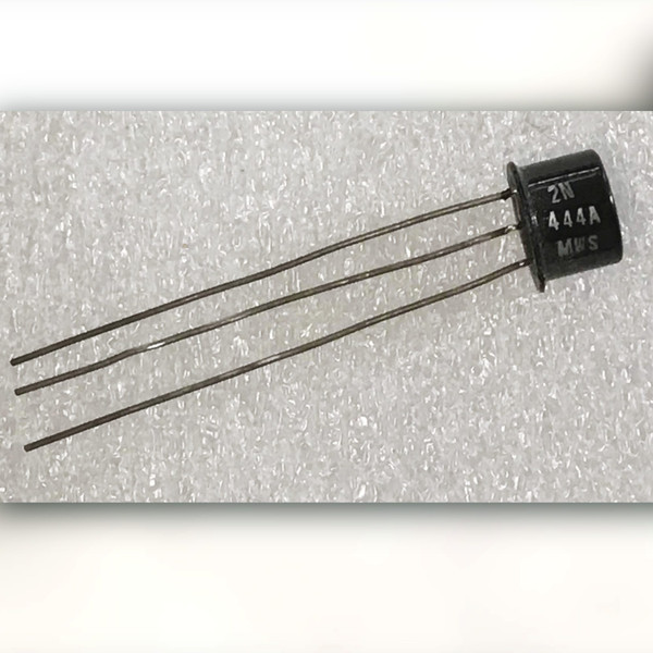 2N444A transistor in a black metal can with white print and three long leads
