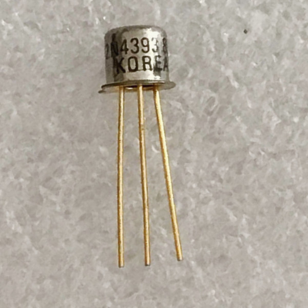 Small metal can transistor with three long leads, partial 4393 marking on the side