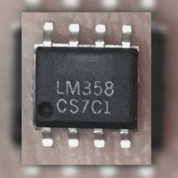 Top view of Texas Instruments LM358 operational amplifier in SOIC-8 package showing part markings.