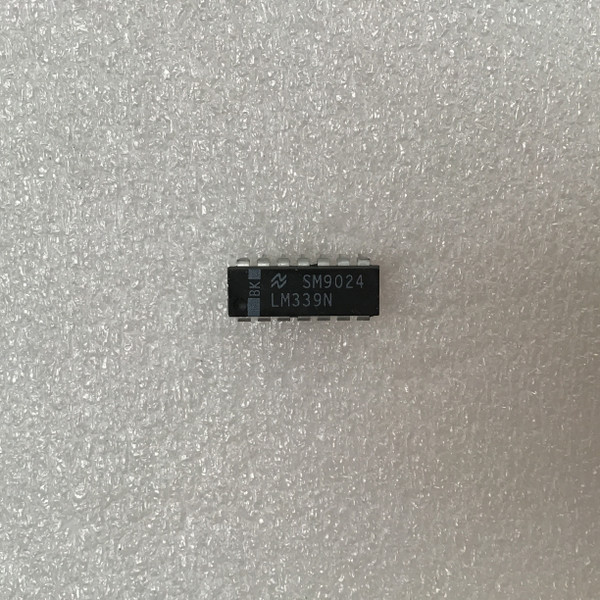 National Semiconductor logo, LM339N, SM9024, BK markings clear, pins straight, body clean, no visible damage.