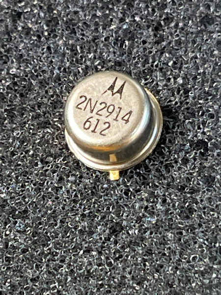 Motorola 2N2914 transistor can top showing logo, part number, and date code on foam.