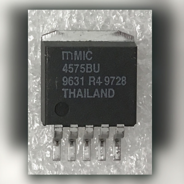 Micrel MIC4575BU marked 4575BU 9631 R4 9728 THAILAND on a light crinkled surface