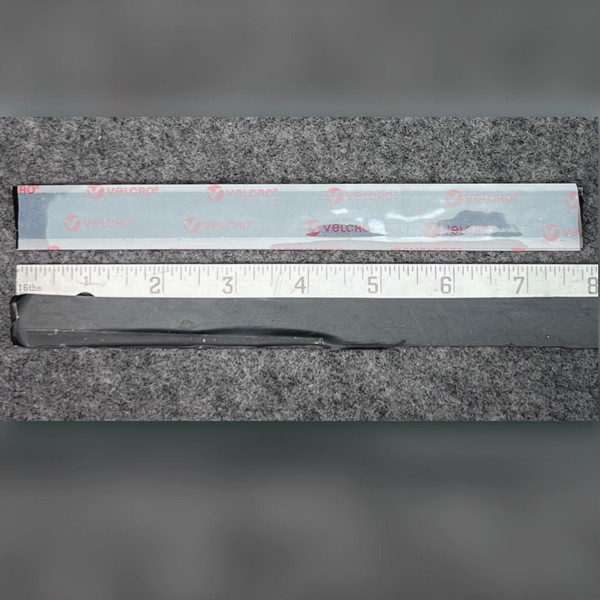 Genuine Velcro 90438blk hook and loop strip pair beside an inch rule, liner side and black face up