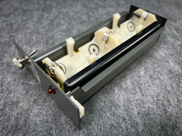 Allen Bradley 1772-B1 battery holder with red LED indicator and battery contacts visible.