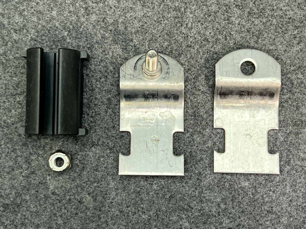 Swagelok SS-TBC12 tube support bracket parts: two plates, black cushion, hex locknut