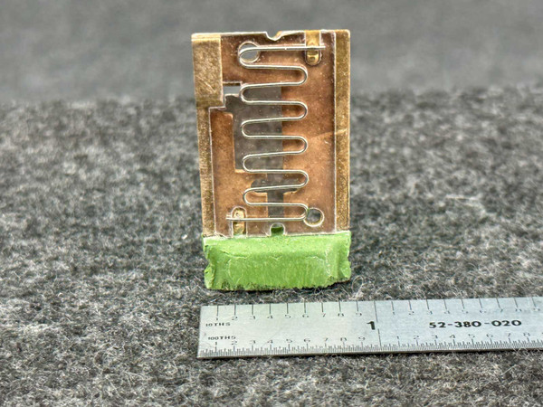 General Electric GE H2.05A thermal overload heater element, a rectangular electrical component featuring a metallic serpentine heating coil on a brown substrate, ideal as a replacement part for industrial motor control or circuit protection. The bottom of the unit is sealed with a textured green potting compound, presented against a dark gray background with a ruler indicating its approximate 1.5inch length.