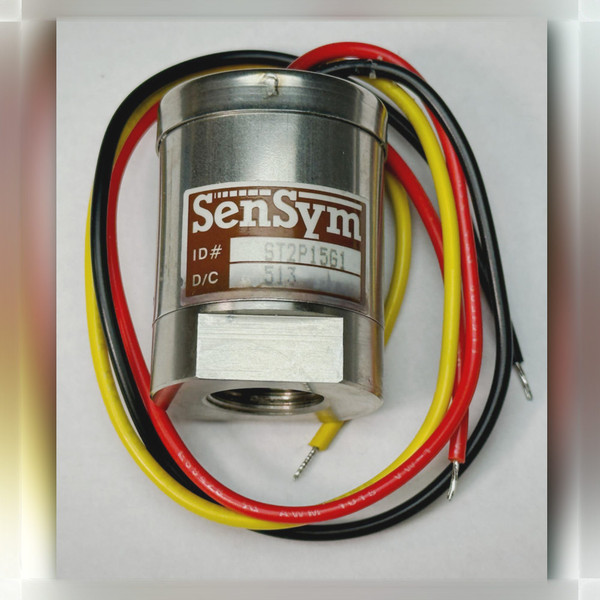 SenSym ST2P15G1 pressure sensor with red, black, and yellow lead wires coiled around housing.