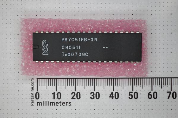 NXP P87C51FB-4N 40-pin DIP microcontroller on pink anti-static bubble wrap beside ruler