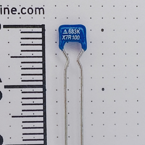 Marking detail on a blue 68nF 100V X7R ceramic capacitor reading 683K and X7R 100.