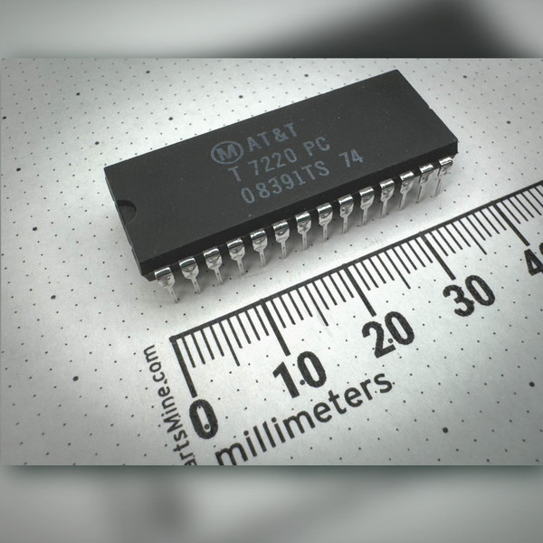 Angled view of AT&T T7220PC 28-pin DIP integrated circuit beside PartsMine millimeter ruler