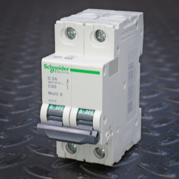 Angled view of Schneider Multi 9 C60 D 3A two-pole breaker 24518, handles at OFF