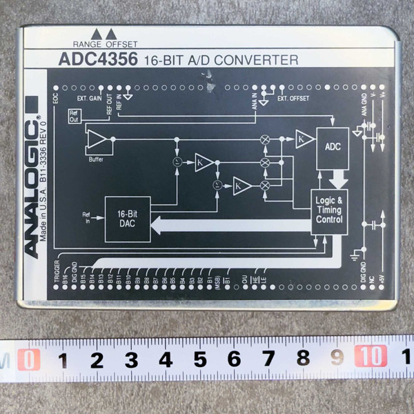 Top view of the Analogic ADC4356 16-Bit A/D Converter Module from PartsMine.com, showing labeled circuit diagram and pin layout with a ruler for scale.