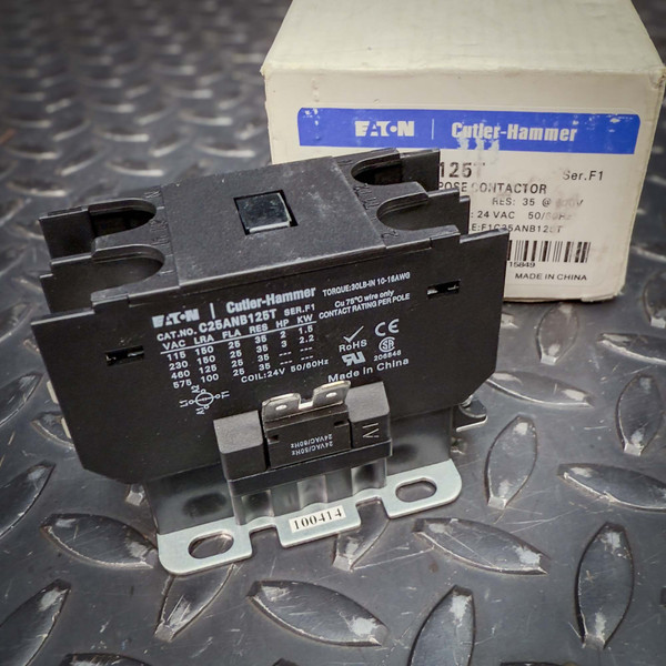 Eaton Cutler-Hammer C25ANB125T definite purpose contactor from PartsMine.com shown angled on a metal surface, with its labeled box in the background.