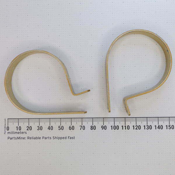 Pair of Umpco AN742 D32 aluminum loop clamps designed for 2-inch cylindrical components, featuring a simple C-shape and bent mounting tabs, displayed above a ruler marked in millimeters.
