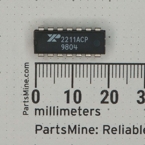 Marked 2211ACP with date code 9804, all 14 leads straight and bright; approximately 20mm body length confirmed by scale.