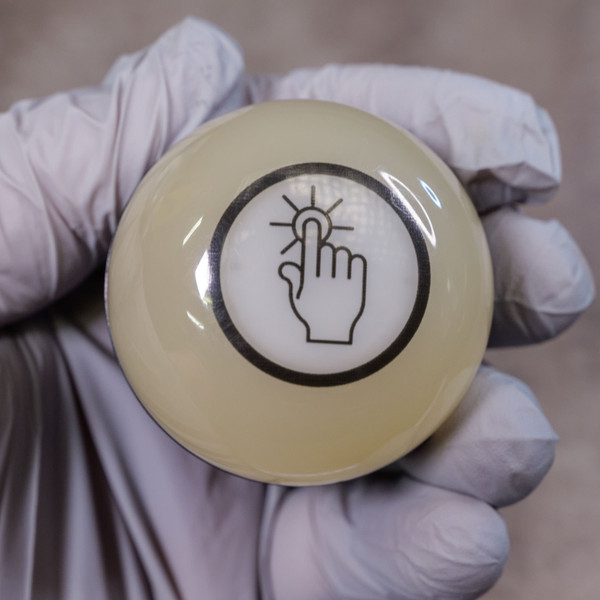 Banner capacitive touch button dome showing clear touch symbol no visible scratches or defects.