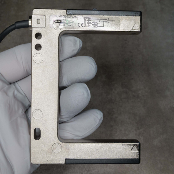 Banner safety switch SLM80B6QPMA showing "Coded Type 1" and CE mark. No visible wear or damage.