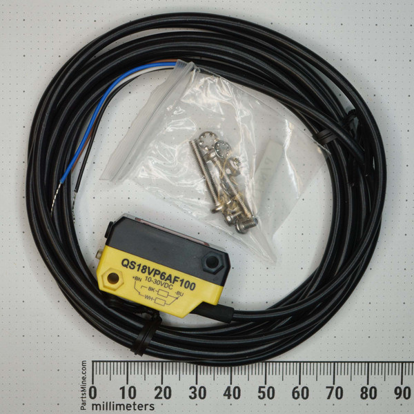 Banner QS18VP6AF100 sensor, 10-30VDC, +BN, -BU, BK, WH visible on label. Integral cable intact, stripped ends. Mounting hardware in sealed bag. No visible damage.