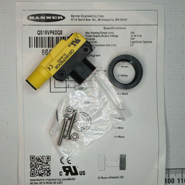 Banner QS18VP6DQ8 sensor showing new condition, M12 threads intact. Includes mounting hardware in bag and black plastic nut.