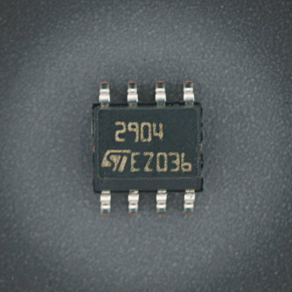 STMicroelectronics LM2904 SOIC-8 IC showing clear markings "2904" and "ST EZ036". Leads are clean with no visible oxidation or damage.