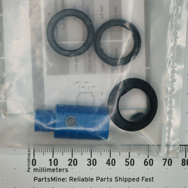 Factory-sealed bag contains threaded sensor body with blue protective cap and three knurled black plastic locknuts; partial labels show LTR-M13PA, LRR-M13PA, LRR-M18PA; 3.5 mm noted.