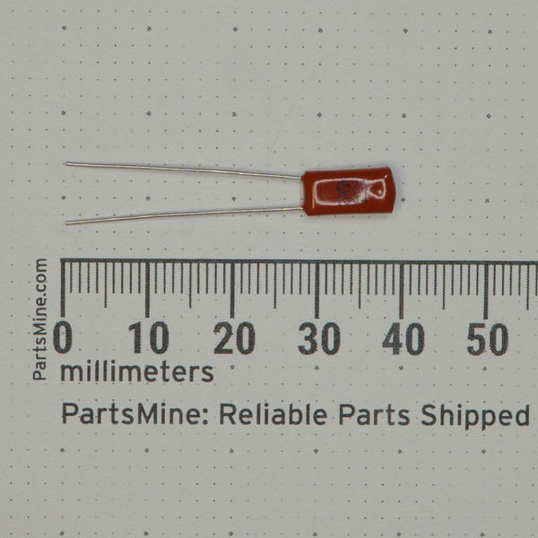 Rust-red epoxy body approximately 7mm long; both radial leads straight and unclipped at ~28mm. Body markings partially legible; circled S visible.