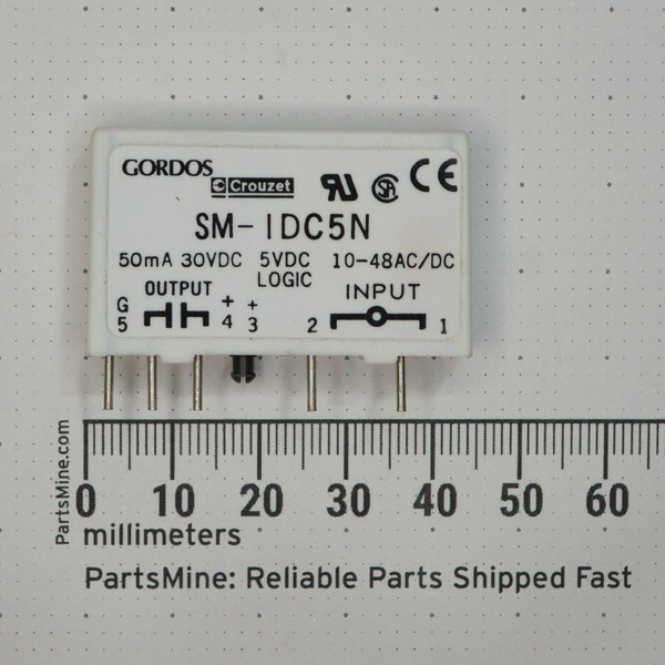 White SIP module body, label reads: 50mA 30VDC, 5VDC LOGIC, 10-48AC/DC INPUT. Six through-hole pins intact, no visible damage.
