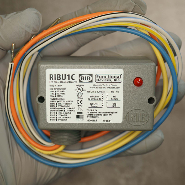 Gray plastic enclosure with red LED indicator unlit; label shows code 397001AB, date 071811. Multi-color wire leads present, ends bare.
