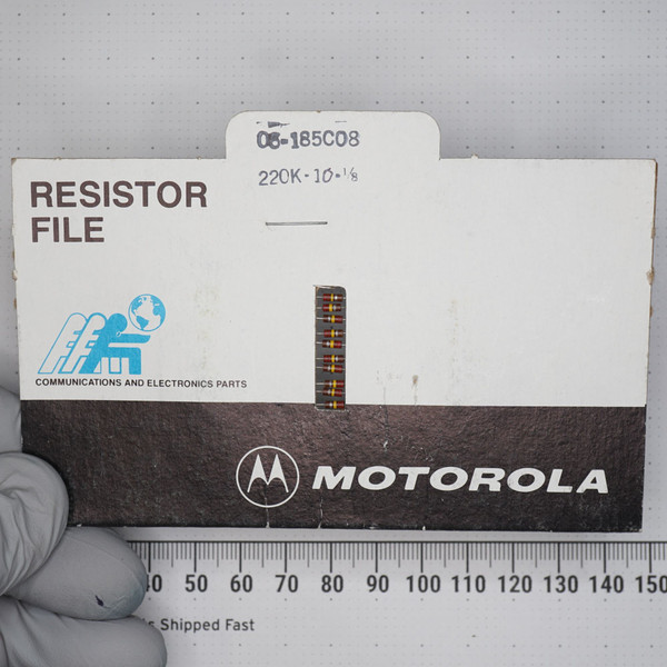 Motorola resistor file card, part number 06-185C08 on tab, marked 220K-10-1/8. Ten axial-lead resistors taped to card face. Light wear on card edges.