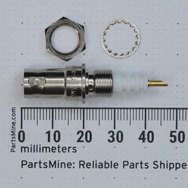 Nickel-plated body approximately 35mm long with white dielectric insert, gold-plated center pin, hex nut, and internal-tooth lockwasher included.