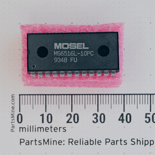 Top view of MOSEL MS6516L-10PC 24-pin DIP integrated circuit on pink foam.