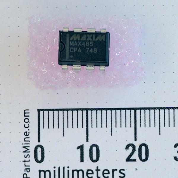 MAXIM MAX485 CPA 8-pin DIP IC on pink foam next to a millimeter ruler.
