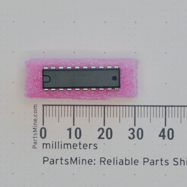 Top view of Texas Instruments SN74AS760N DIP-20 integrated circuit on foam with a millimeter ruler.