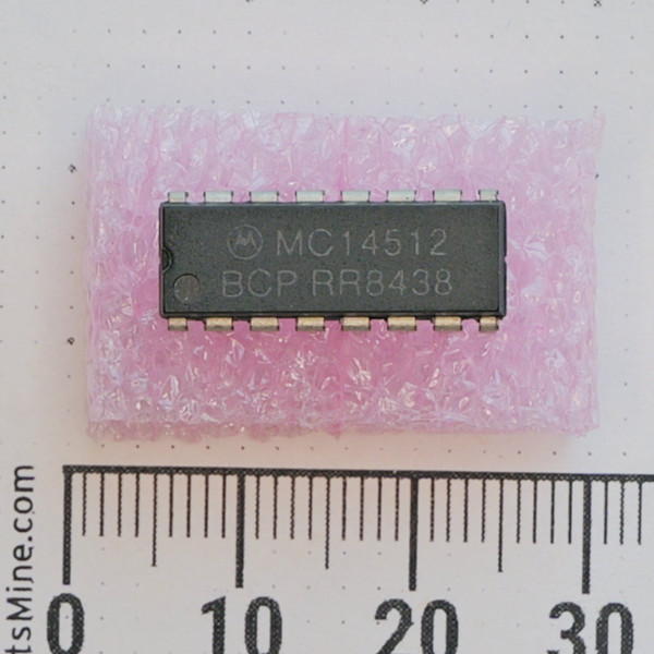 Motorola MC14512BCP 16-pin DIP integrated circuit on pink foam.