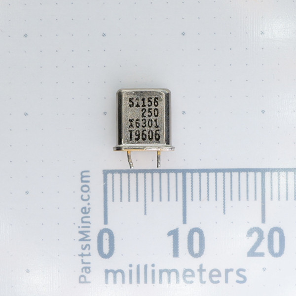 Front view of VARIOUS 51156 250 crystal unit with printed markings next to a ruler.